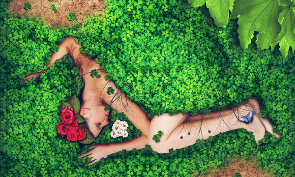 An artistic picture of a person covered in vegetation and flowers in this  blog post about the importance Earth Day on the IRON EARTH™ Gardening Tips Blog.
