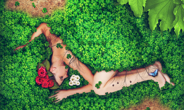 An artistic picture of a person covered in vegetation and flowers in this  blog post about the importance Earth Day on the IRON EARTH™ Gardening Tips Blog. 